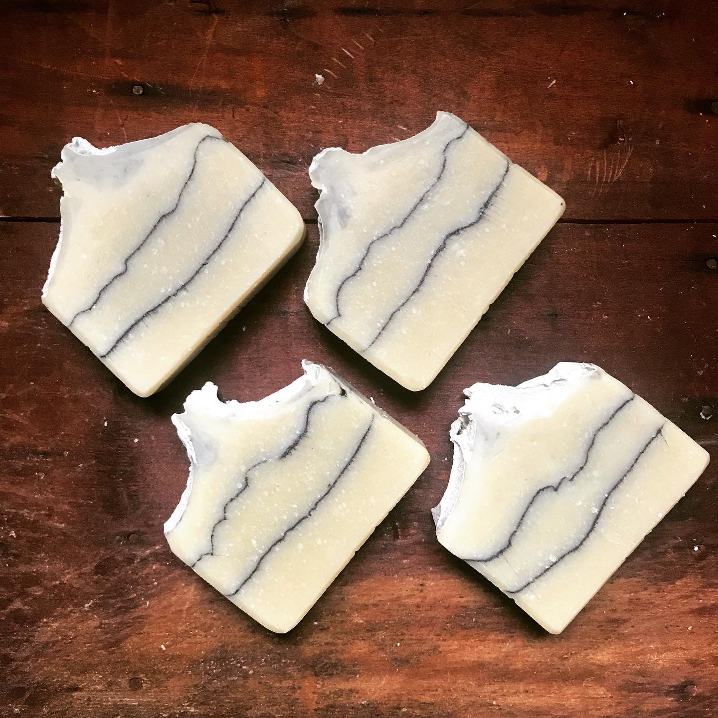 Natural, vegan bar soap made with Dead Sea Mud, organic coconut milk, activated charcoal lines, and subtle essential oils. 