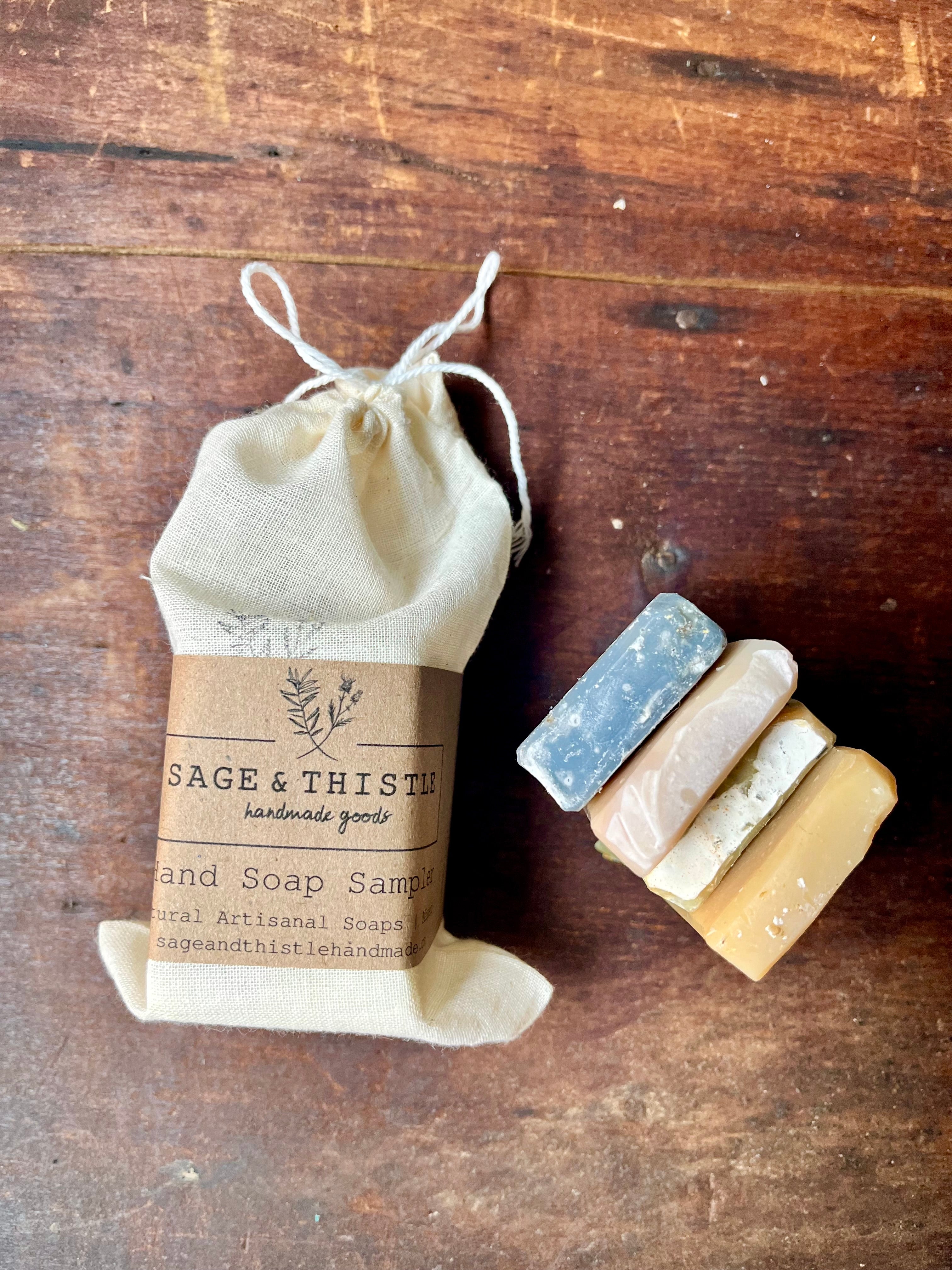 Hand Soap Sampler: A collection of four small, 100% natural artisanal hand soaps packaged in a reusable cotton bag. 